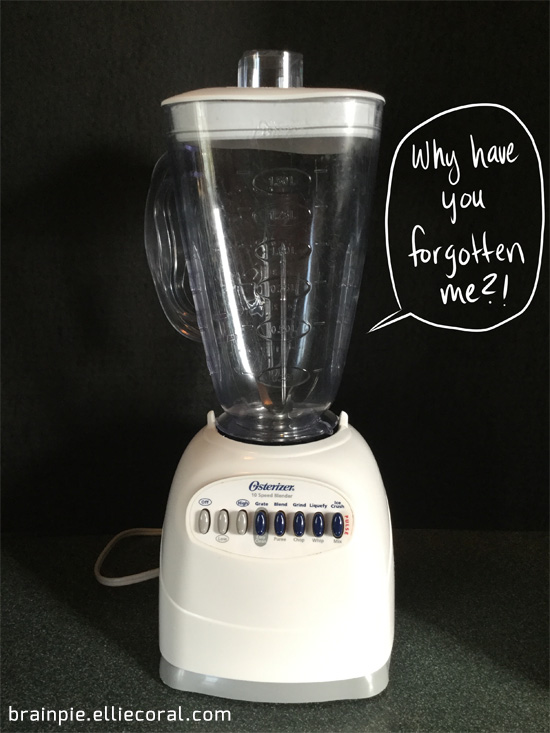 A modern electric blender stands against a black backdrops. It plaintively mews, 'Why have you forgotten me?!'