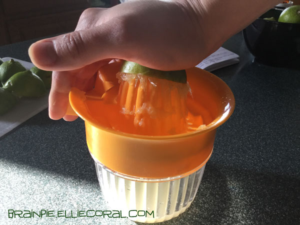 My hand presses down on the lime, trying to squeeze more juice from the fruit. More pulp has been expressed over the juicer top, making a sloppy mess.