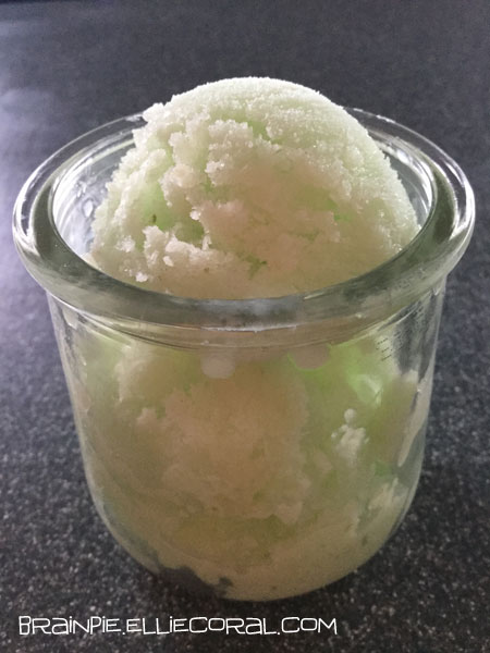 Lime sherbet in a small glass container.