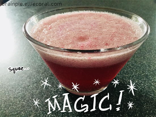 The red liquid has pink sparkling foam on top. Text reads, 'Squee...' and 'MAGIC!'