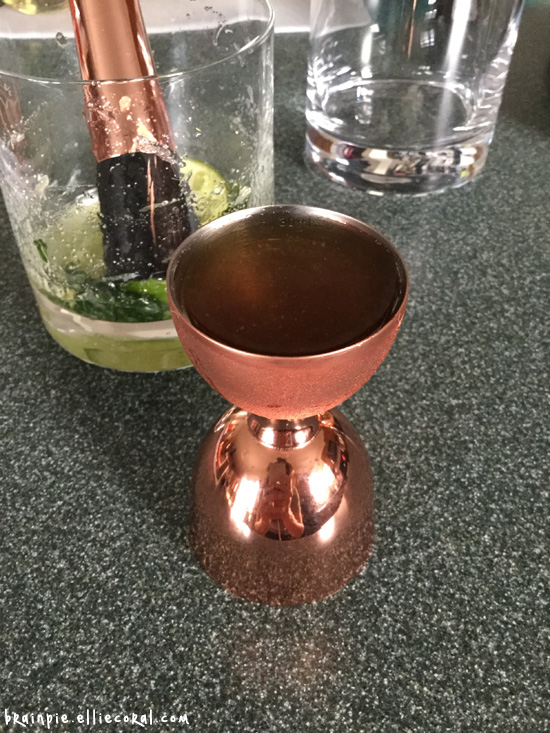 A copper jigger. The blogger's reflection can somewhat be made on the surface.