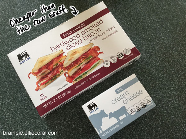 A package of hardwood smoked sliced bacon, fully cooked. Ellie notes that it's cheaper than the raw stuff. Included is a package of cream cheese.