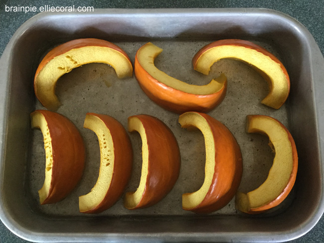 The crescent pumpkin slices have come out of the oven. Some pieces have holes from fork pokings.