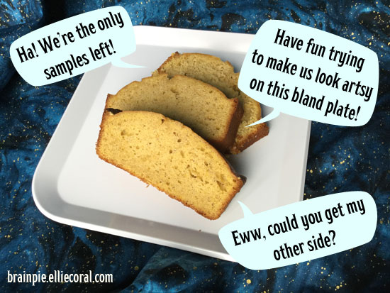 Three loaves of pumpkin bread are arranged on a white plate. One says, 'Ha! We're the only samples left!' Another says, 'Have fun trying to make us look artsy on this bland plate!' The last one with some damage says, 'Eww, could you get my other side?'